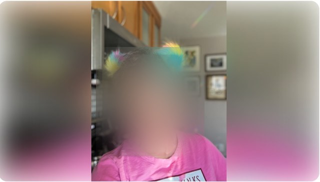 A Buff Muff member at home, face obscured